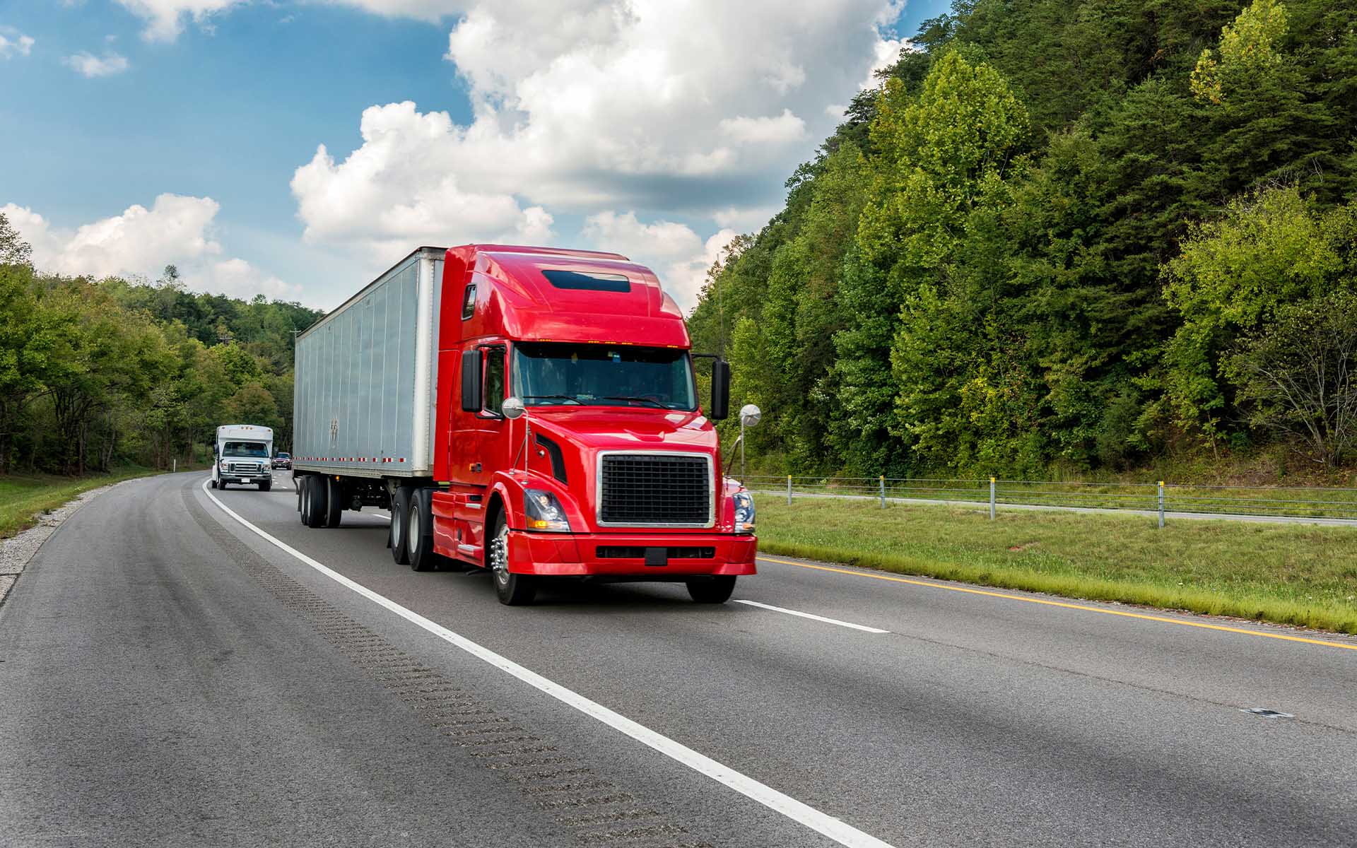 Instant Online Truck Insurance Estimate - Red Truck Driving Down the Road