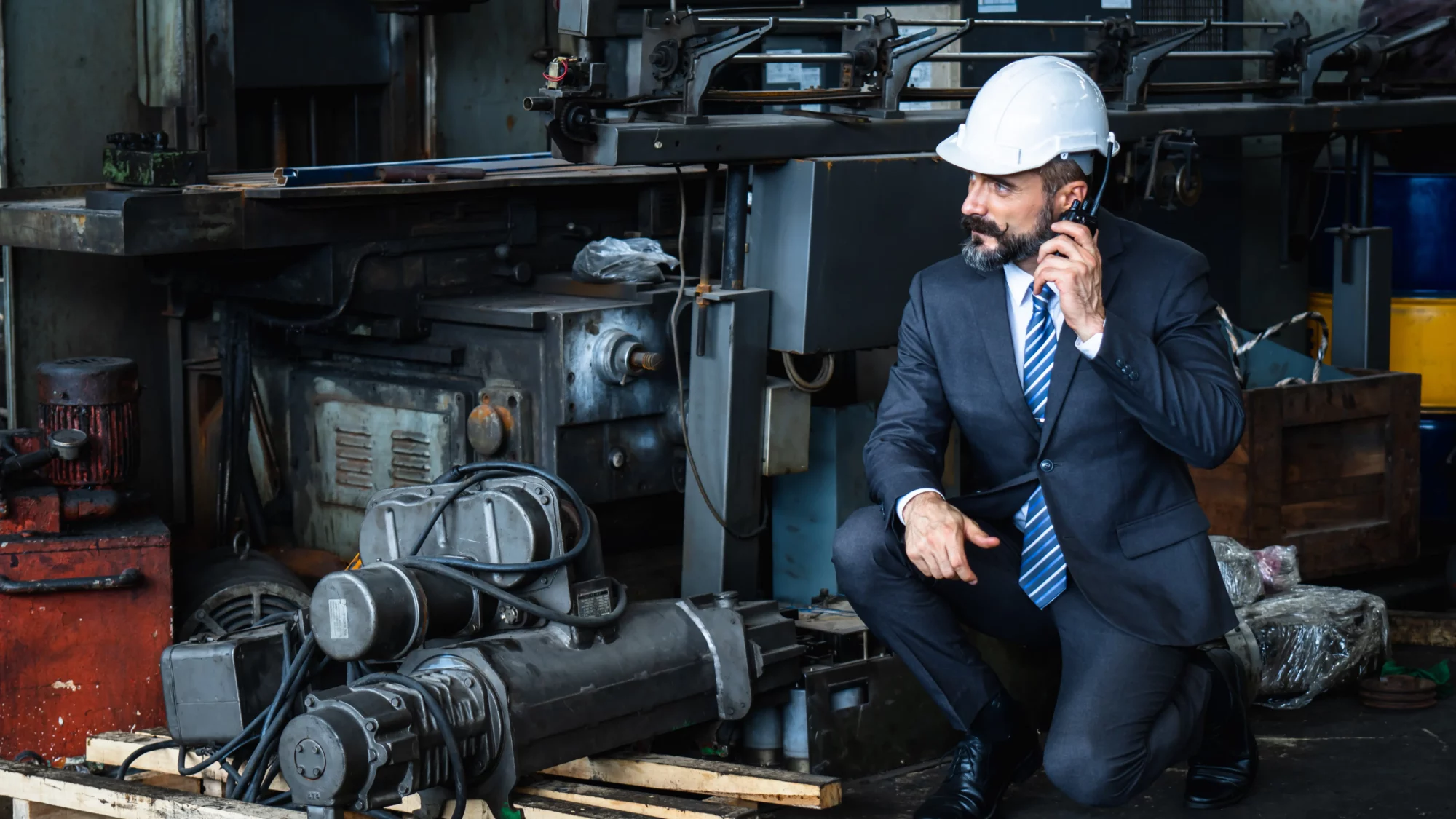 A small business owner beside his equipment