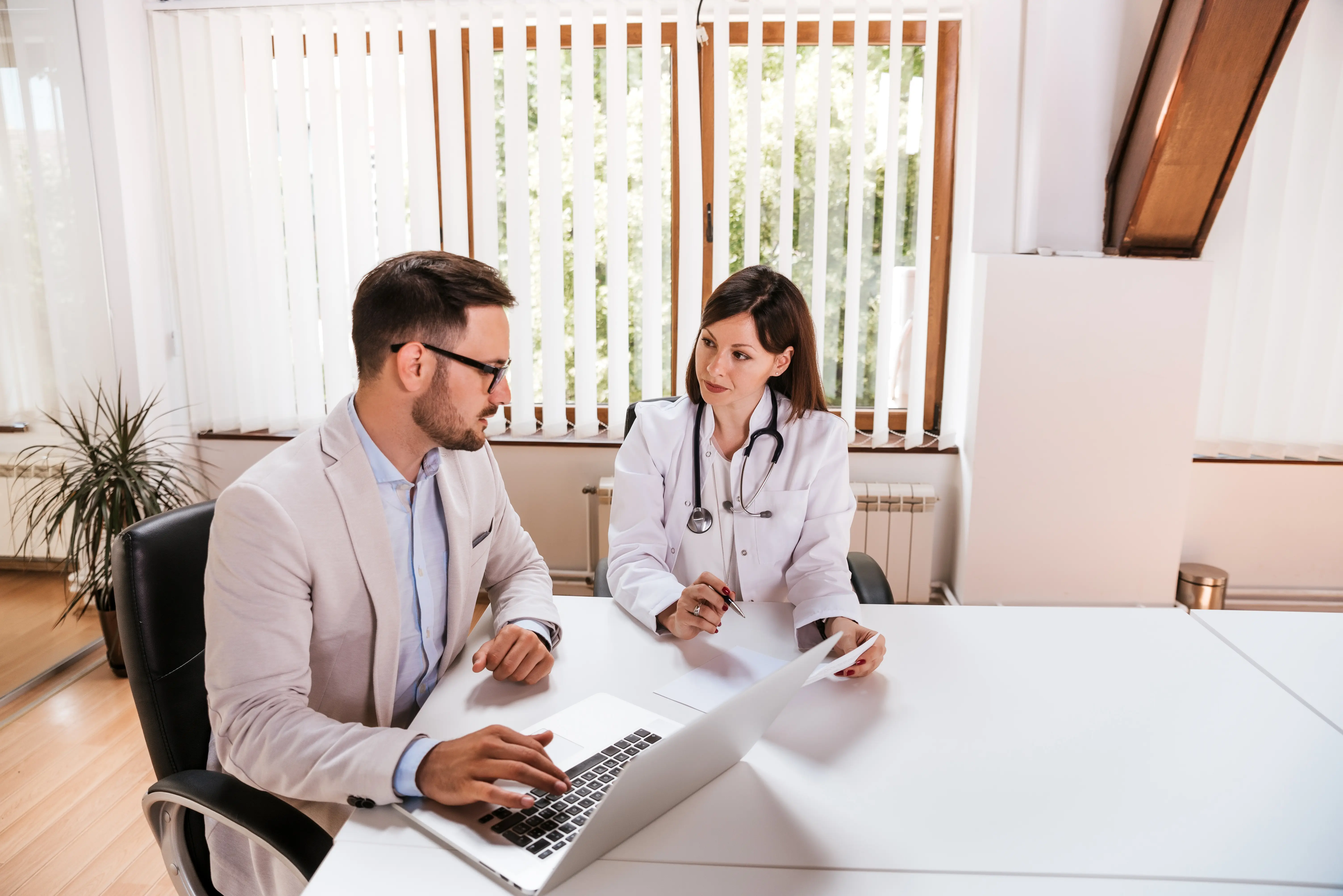 A medical professional consulting with a healthcare consultant