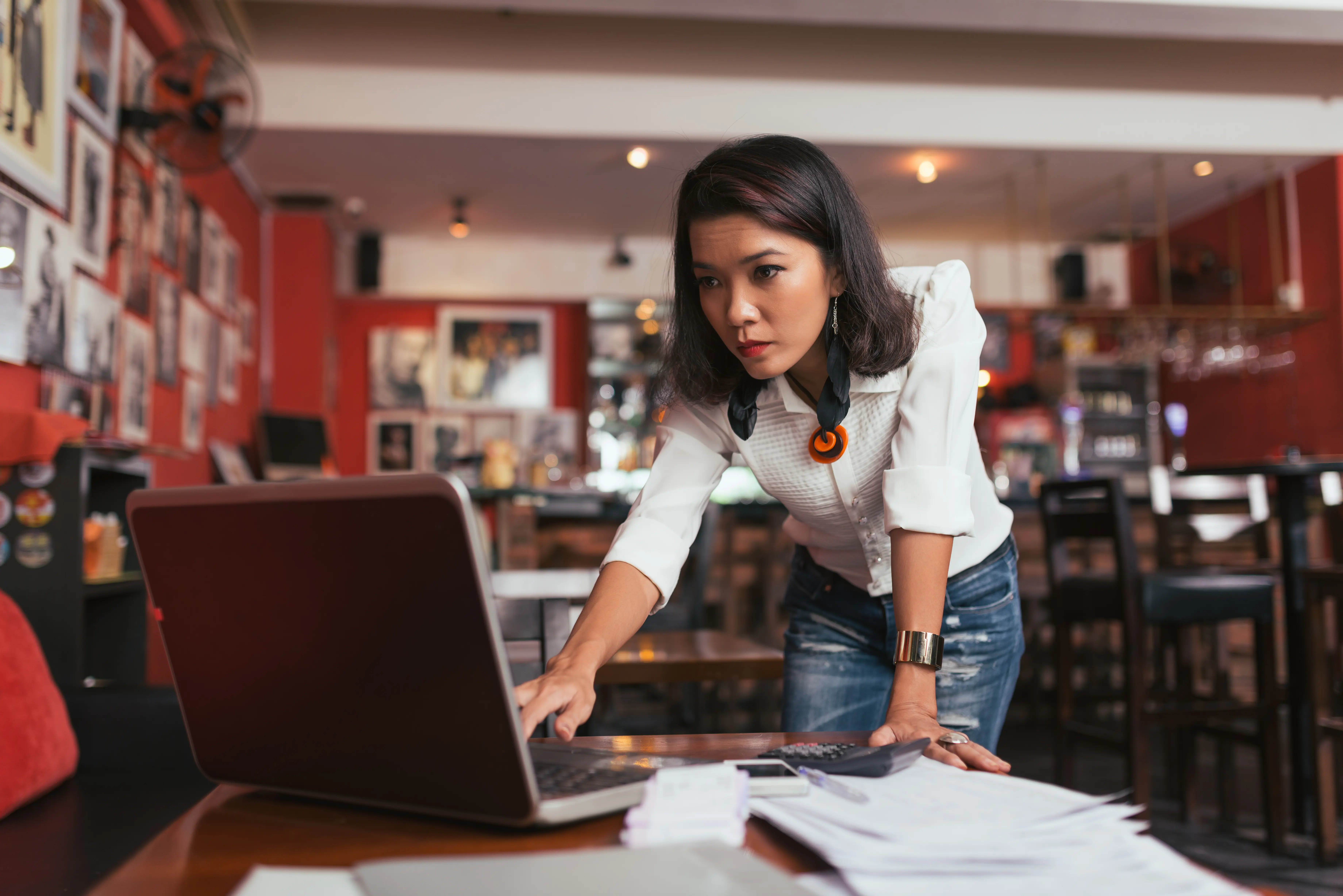 A small business owner looking at small business insurance costs